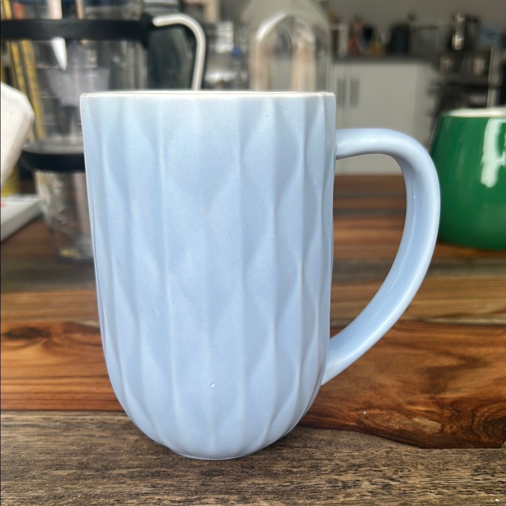 Blue Ceramic Mug with Textured Design and Curved Handle